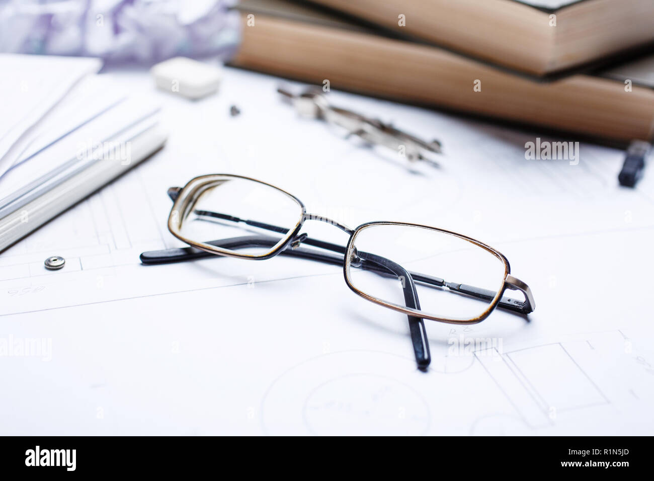 Glasses on the details of the drawing Stock Photo