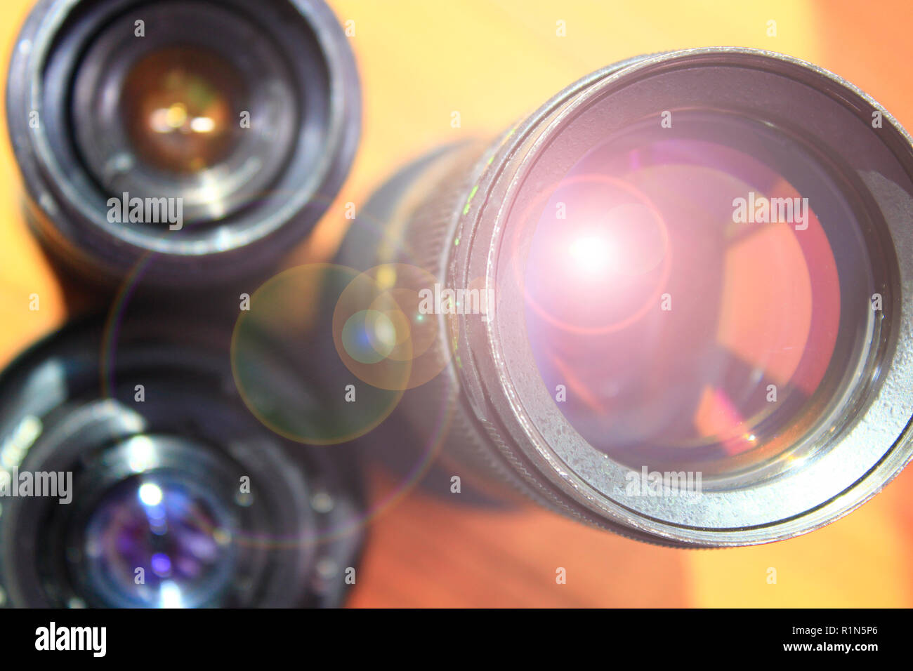 Photographic lens. Modern camera lenses with reflections. Modern camera lenses with reflections. Camera lens Stock Photo
