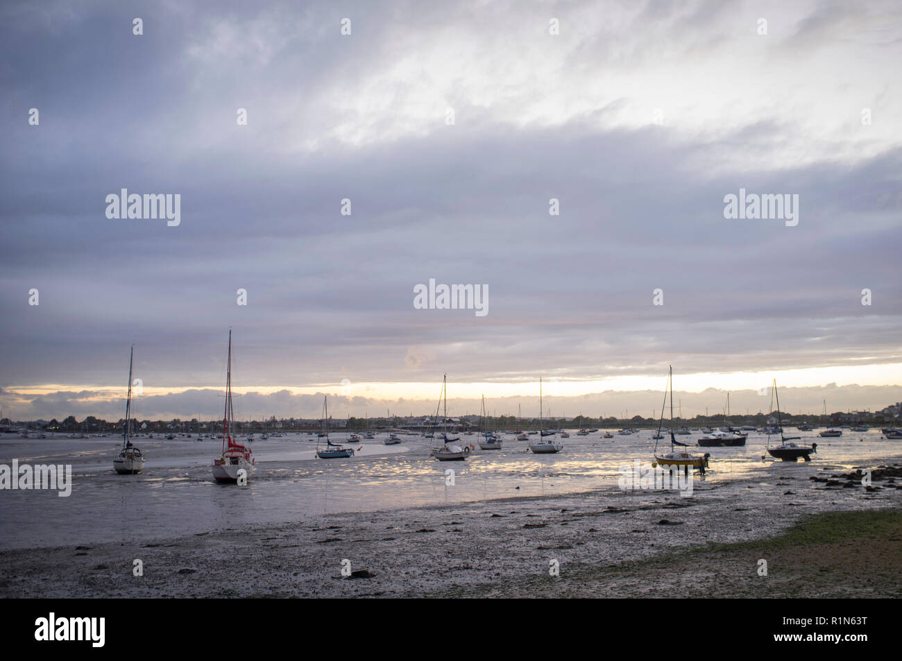 Yachts moored in the estuary of the River Blackwater at low tide in Maldon, Essex Stock Photo