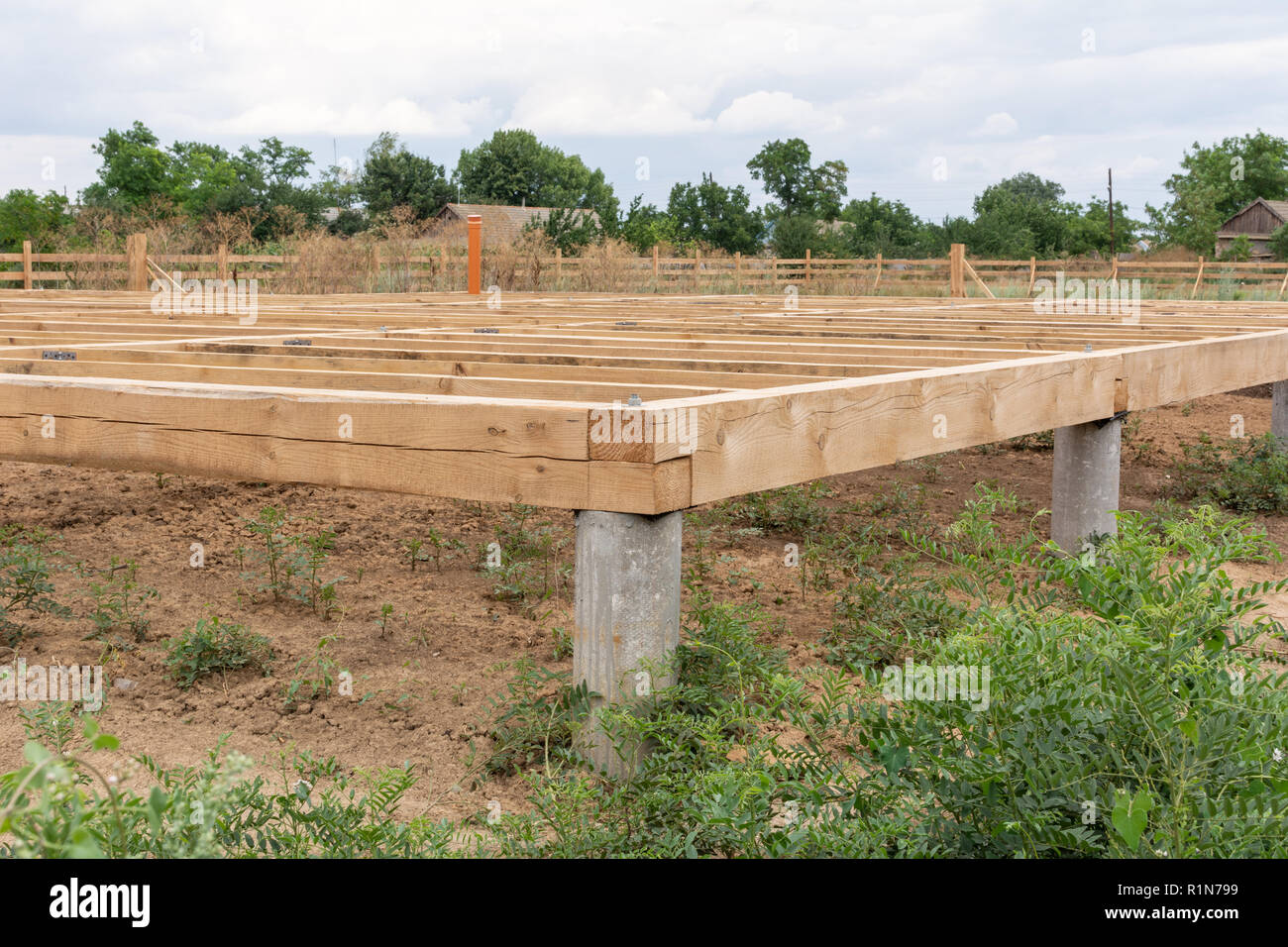 On pile foundations support the floor of a frame house Stock Photo Alamy