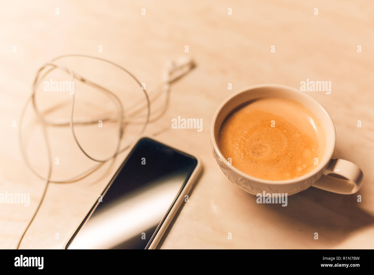 Smartphone phone and coffee on wood blank space Stock Photo