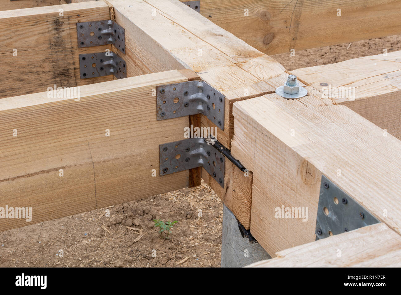 Wooden flooring base under construction. Closeup on pile foundations support the floor. Stock Photo
