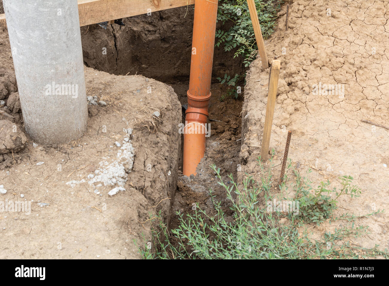 Plumbing pipe to supply water to the house. Stages of construction of