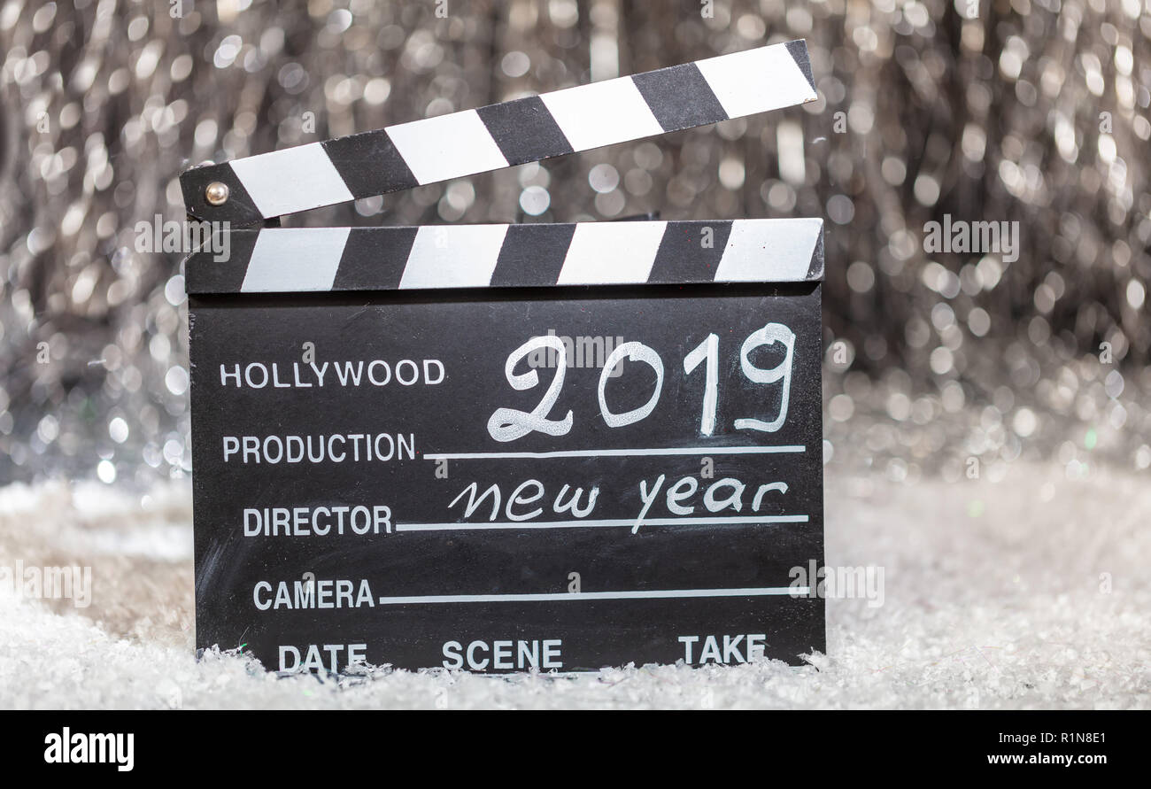 2019, new year on movie clapper, abstract bokeh lights background Stock Photo