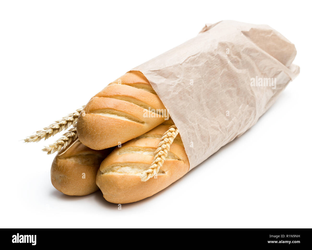 Delicious baguettes in paper bag isolated on white Stock Photo - Alamy