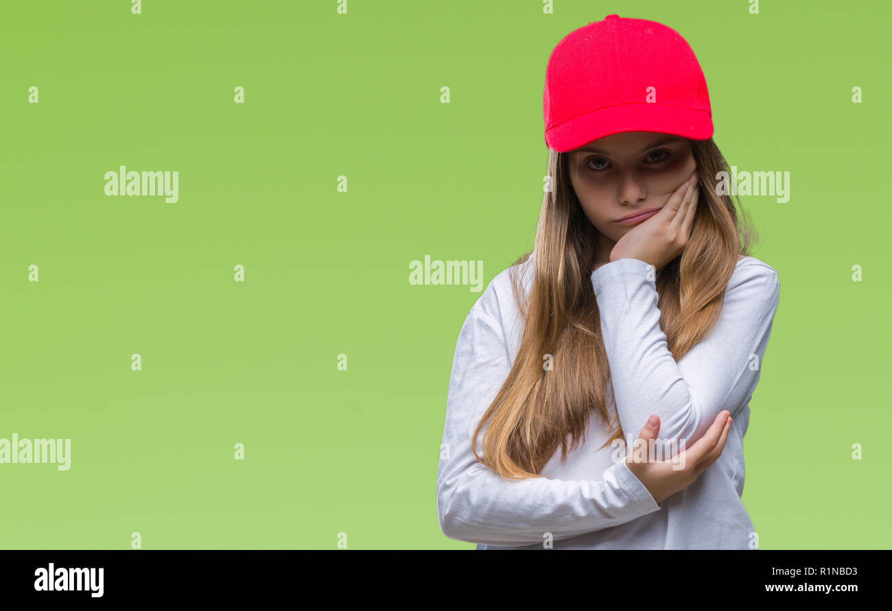 Young beautiful girl wearing red cap isolated background thinking ...