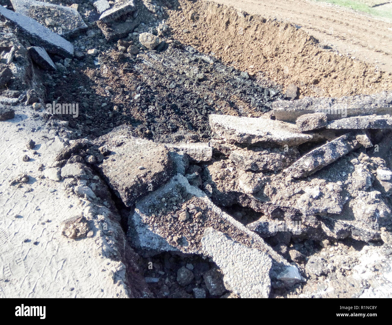 Pit on the road. Dug up the asphalt. Road repair Stock Photo Alamy
