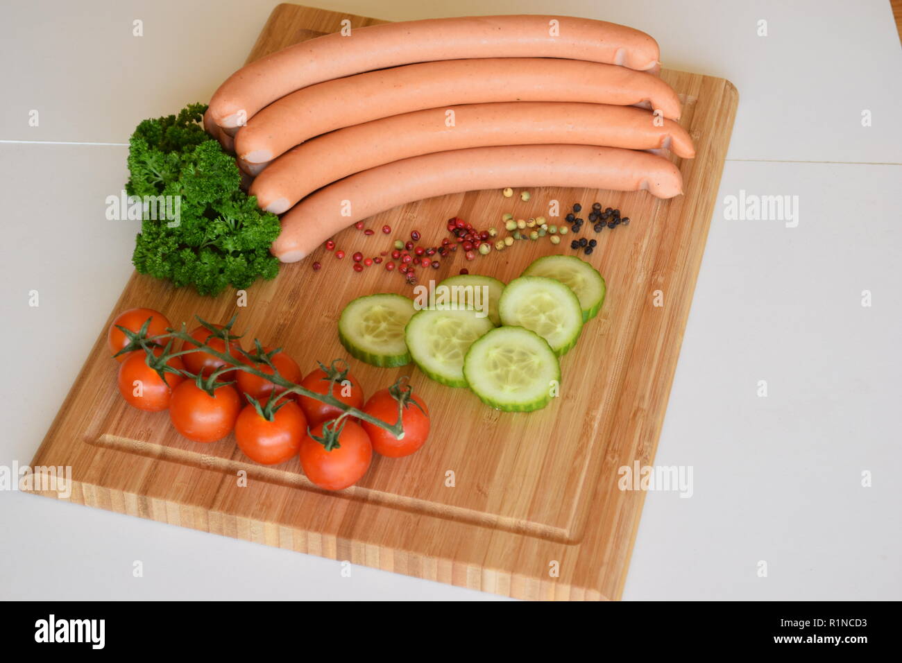 Vienna sausages ('Wiener Würstchen' or 'Frankfurter Würst') on ceramic rustic plate.  Wiener Würstchen oder 'Frankfurter' auf rustikaler Keramikteller Stock Photo