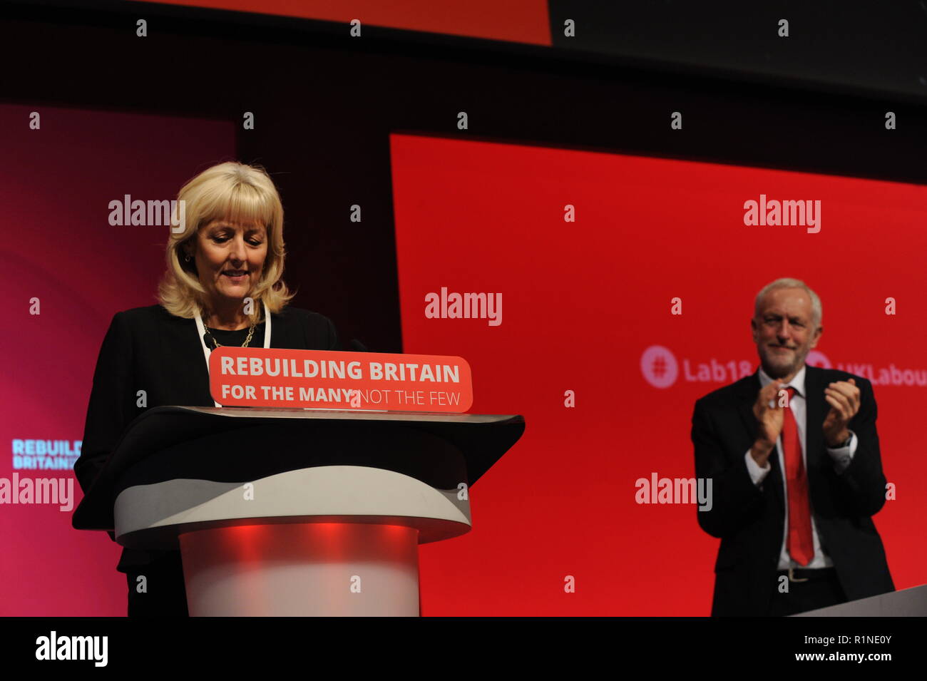 Liverpool, England. 23rd September, 2018.  Jenny Formby, finishes her speech to conference, applauded by Labour Party Leader Jeremy Corbyn, having jus Stock Photo