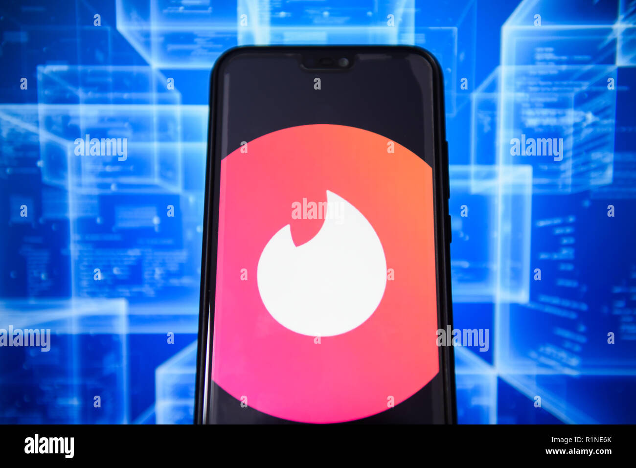 Tinder logo is seen on an android mobile phone. Stock Photo