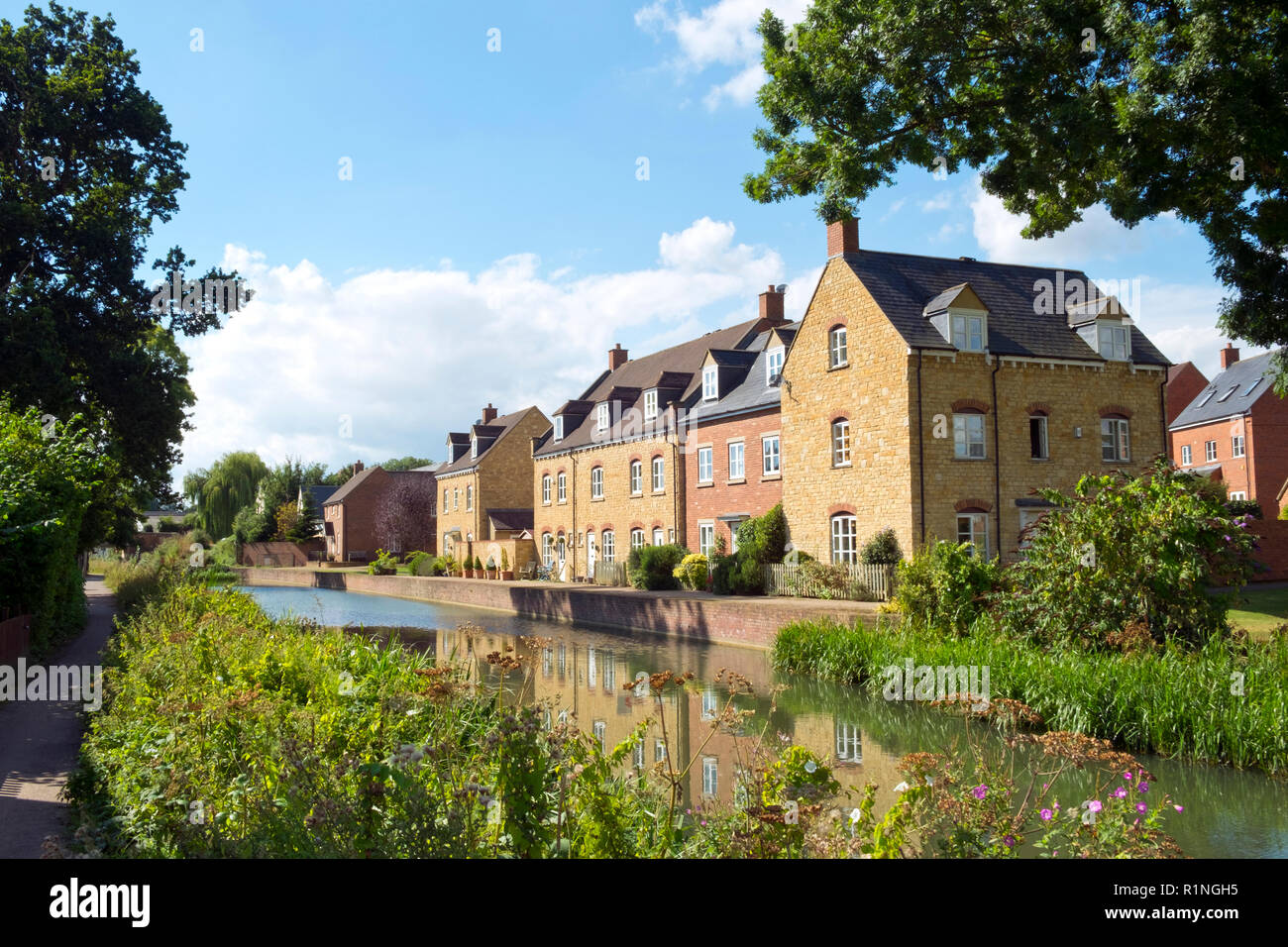 Recently built housing enhances the historic canal near Ebley Mill on