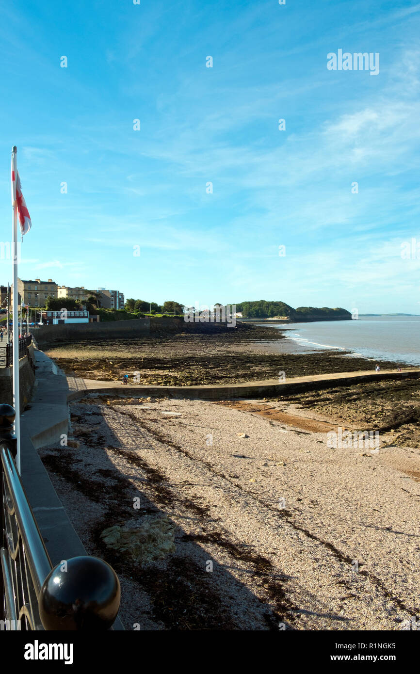 Clevedon, Somerset, UK - 11th September 2016: Late summer sunshine brings visitors to the rocky shore and seafront at Clevedon on the Bristol Channel, Somerset, UK. Clevedon in the Victorian era was a popular seaside resort. Stock Photo