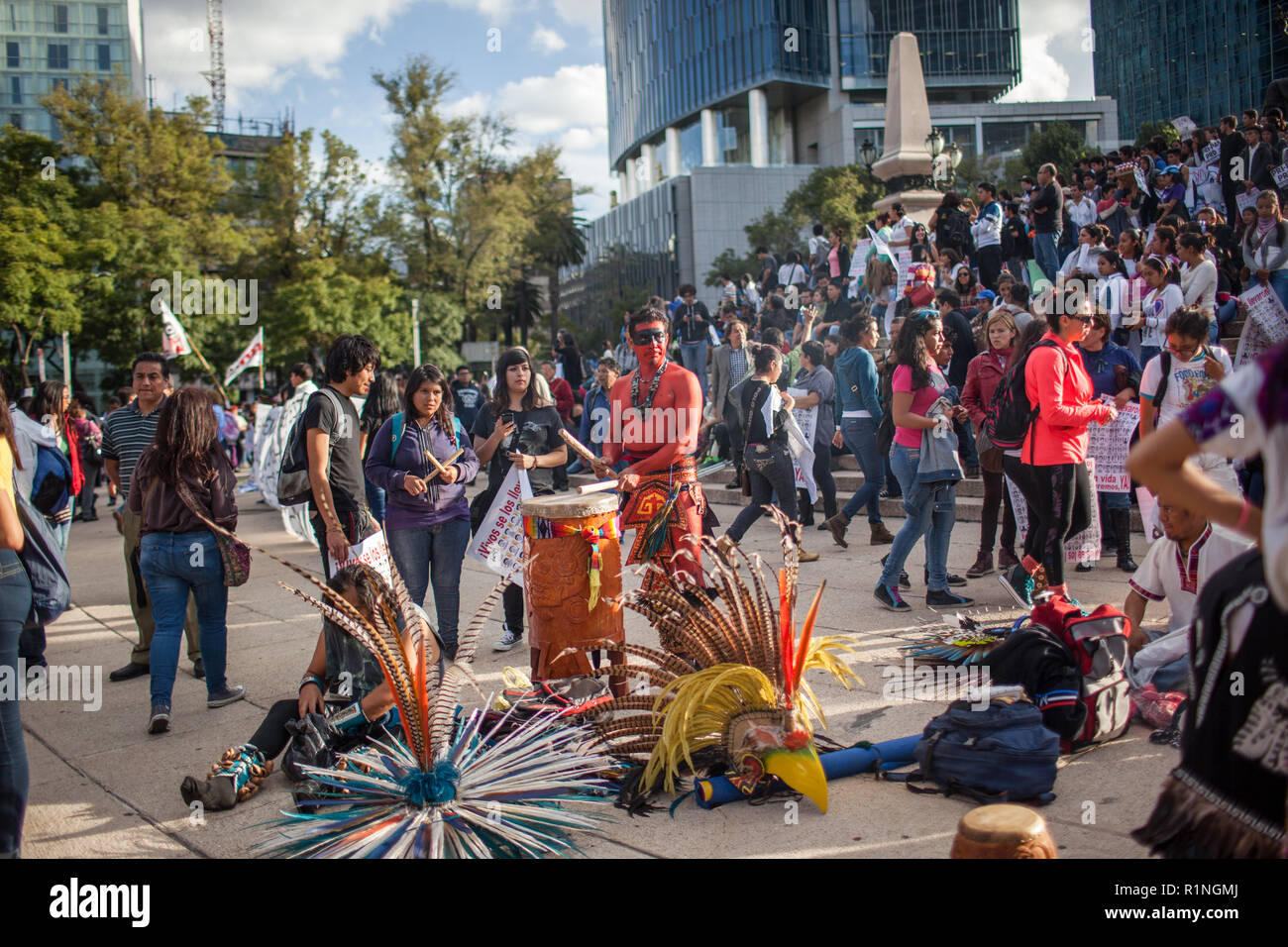 People march through Mexico City during the 'Global Day of Action for Ayotzinapa' Wednesday, October 23, 2014.  The march was held to demand answers following the killing of three students and the disappearance of 43 more in the city of  Ayotzinapa, Guerrero, which is South West of Mexico City.  The students have been missing since September 26, 2014 and the local mayor and his wife are accused of ordering the kidnappings and killings. The local police are also accused of working with  the Guerreros Unidos cartel in the crimes.   Since September 26, many mass graves have been located in the ar Stock Photo