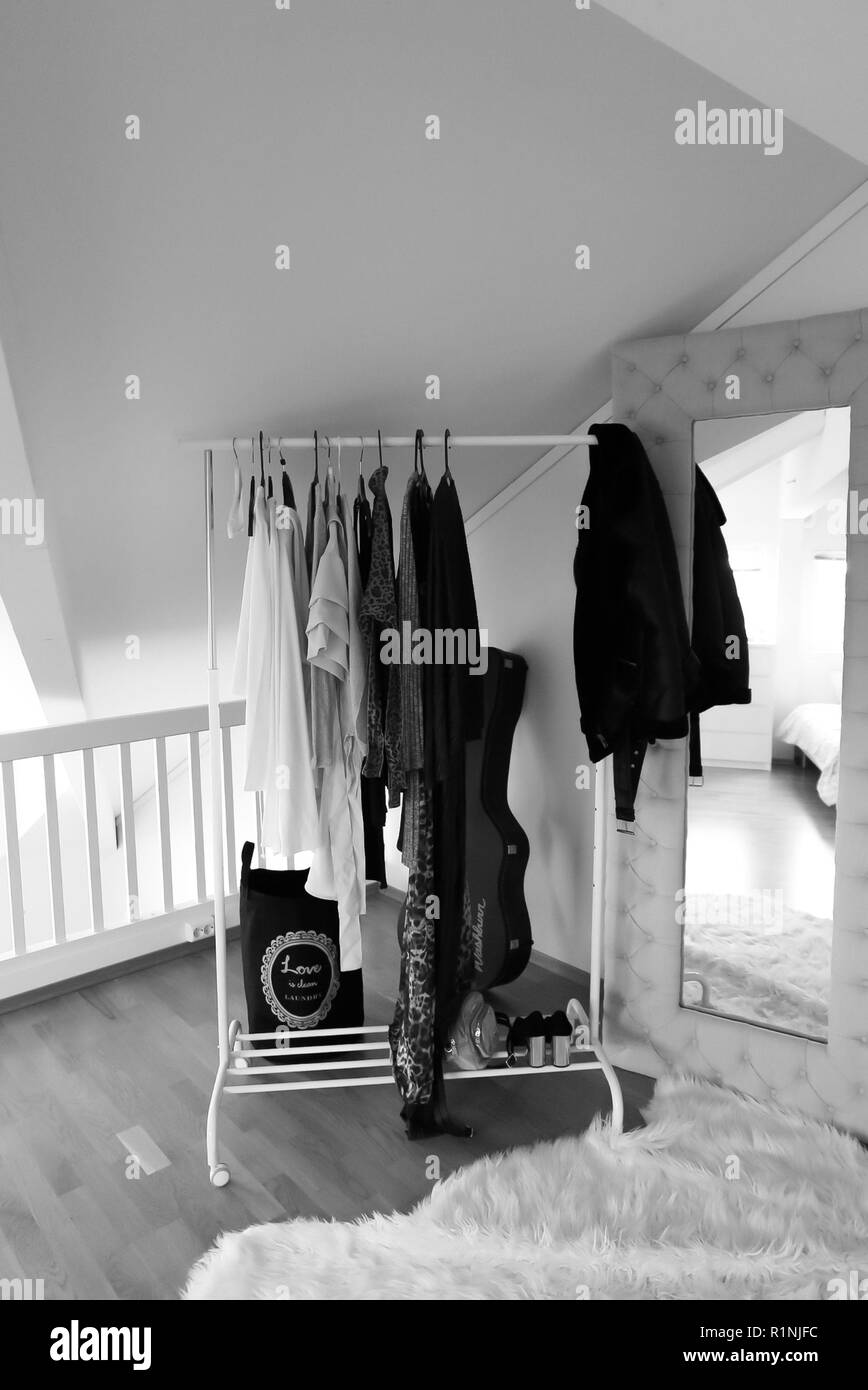 Clothing rack woman Black and White Stock Photos & Images - Alamy
