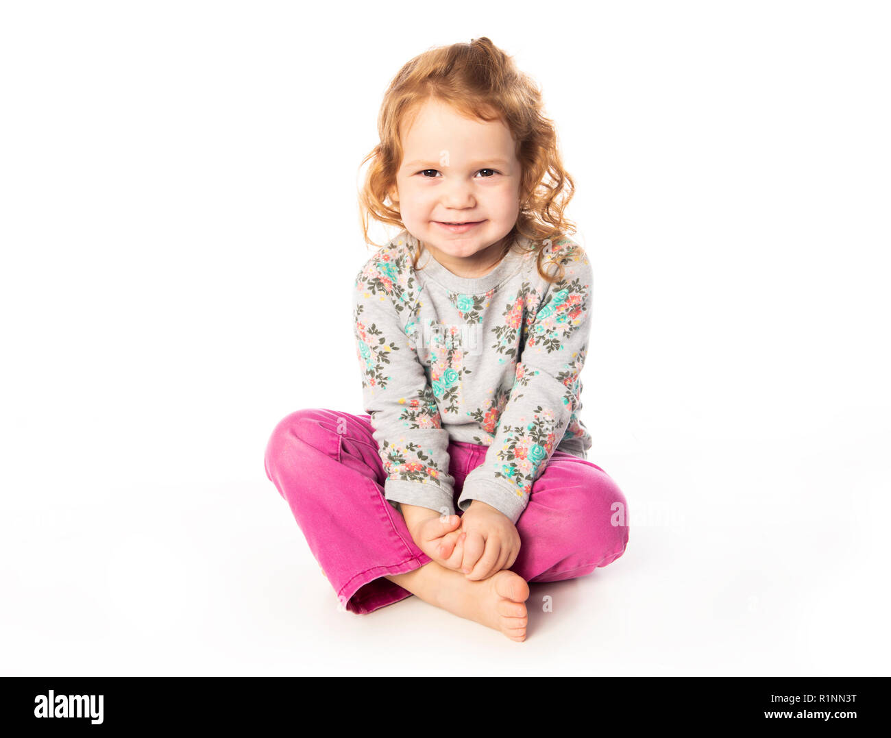 A cute Little Girl with redhead in studio white background Stock Photo A cute Little Girl with redhead in studio white background Stock Photo