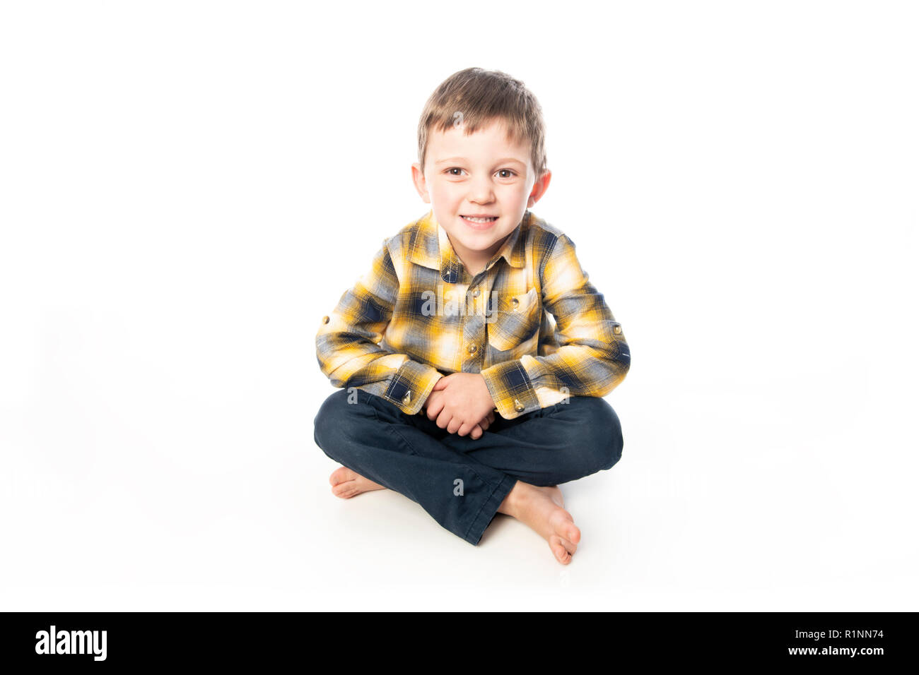 A boy shot in the studio on a white background. Stock Photo