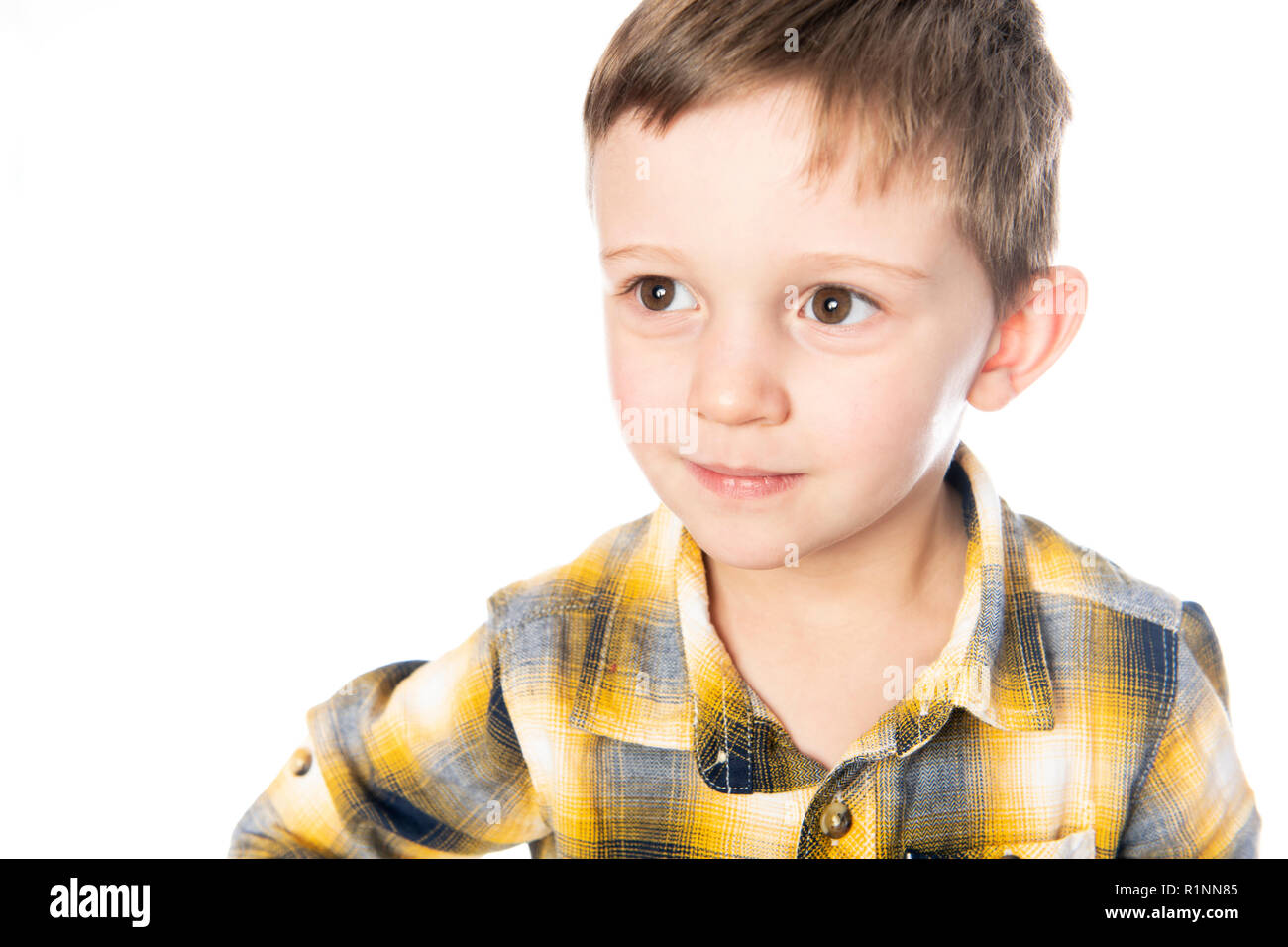 A boy shot in the studio on a white background. Stock Photo