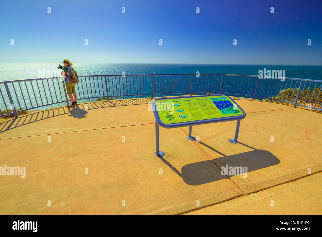 Kalbarri, Australia - Dec 19, 2017: travel photographer takes shot of Natural Bridge platform lookout in Kalbarri National Park, Western Australia. Popular attraction of Bigurda boardwalk. Stock Photo