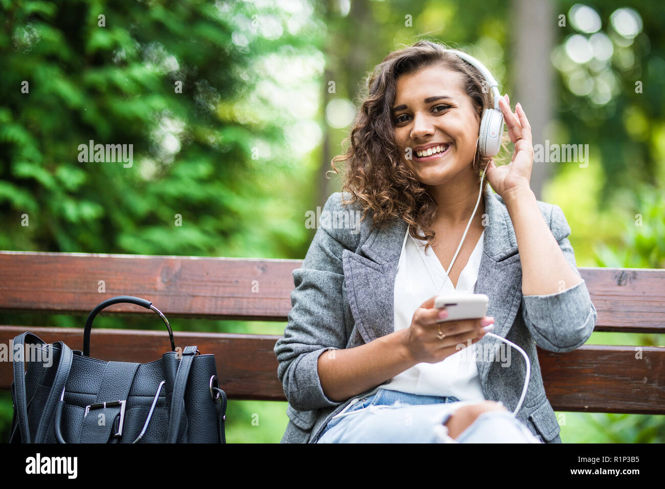 Smiling blonde girl sitting crossed hi-res stock photography and images ...