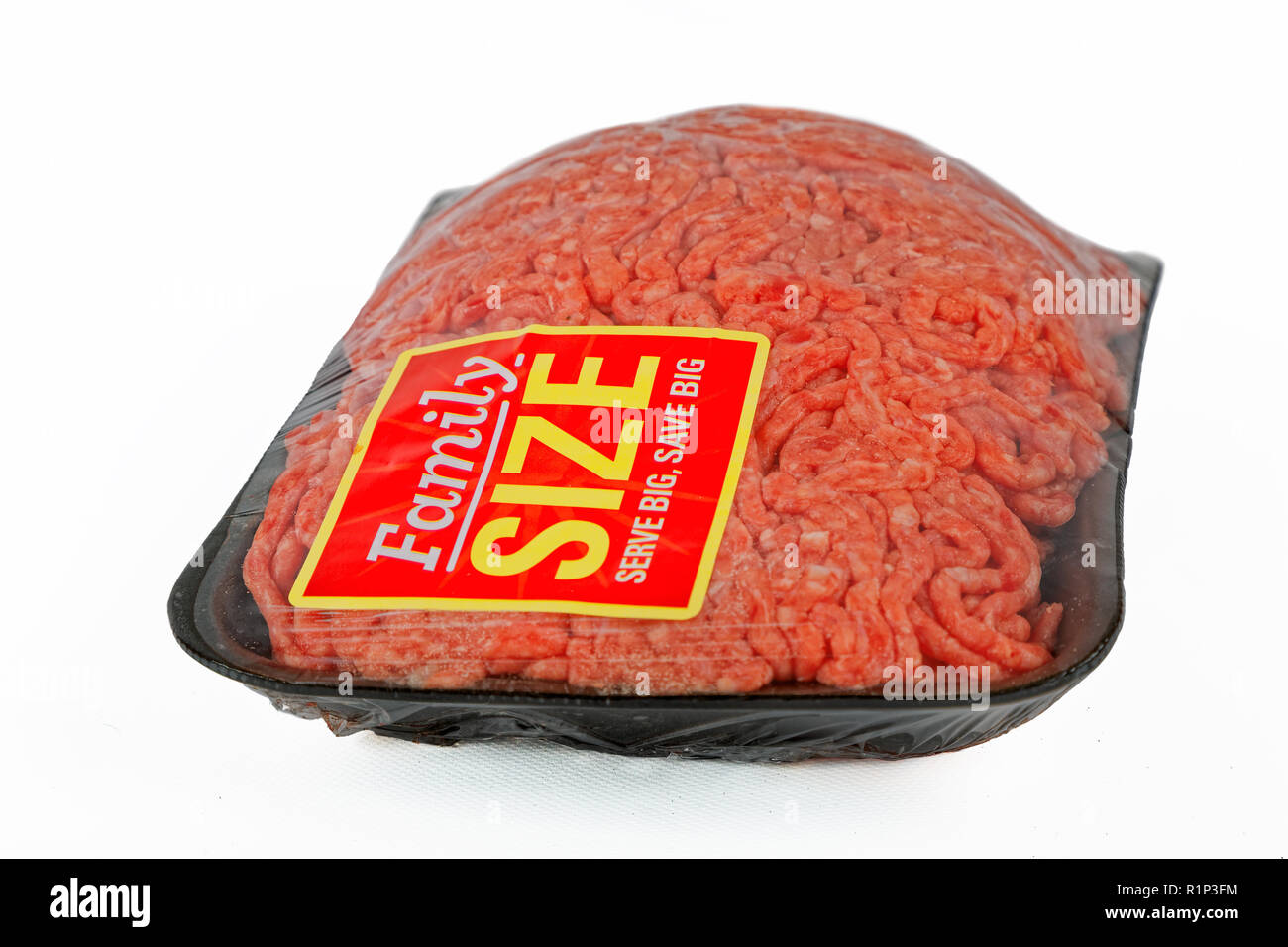 A package of ground meat wrapped in cellophane with a family size sticker  Stock Photo - Alamy