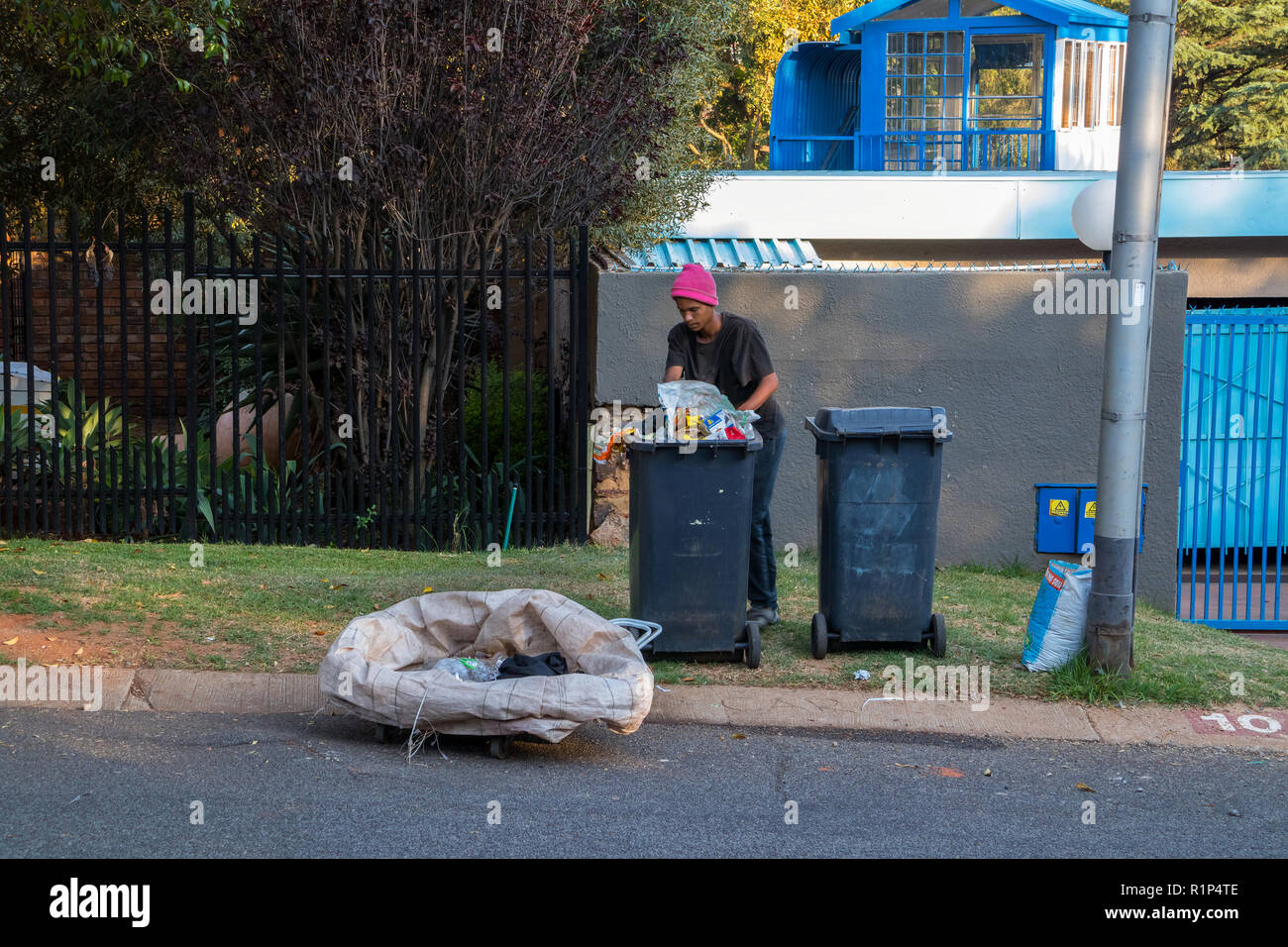 Poor and desperate jobless and homeless people raid waste bins in