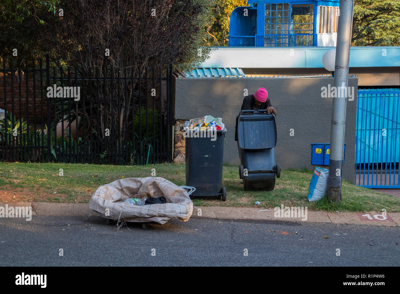 Poor and desperate jobless and homeless people raid waste bins in