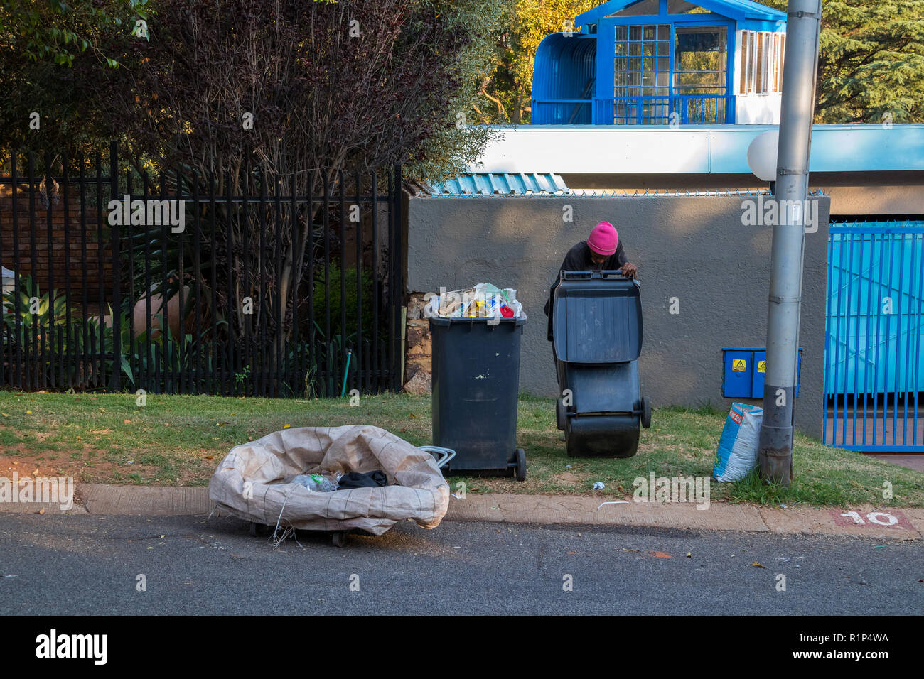 Poor and desperate jobless and homeless people raid waste bins in