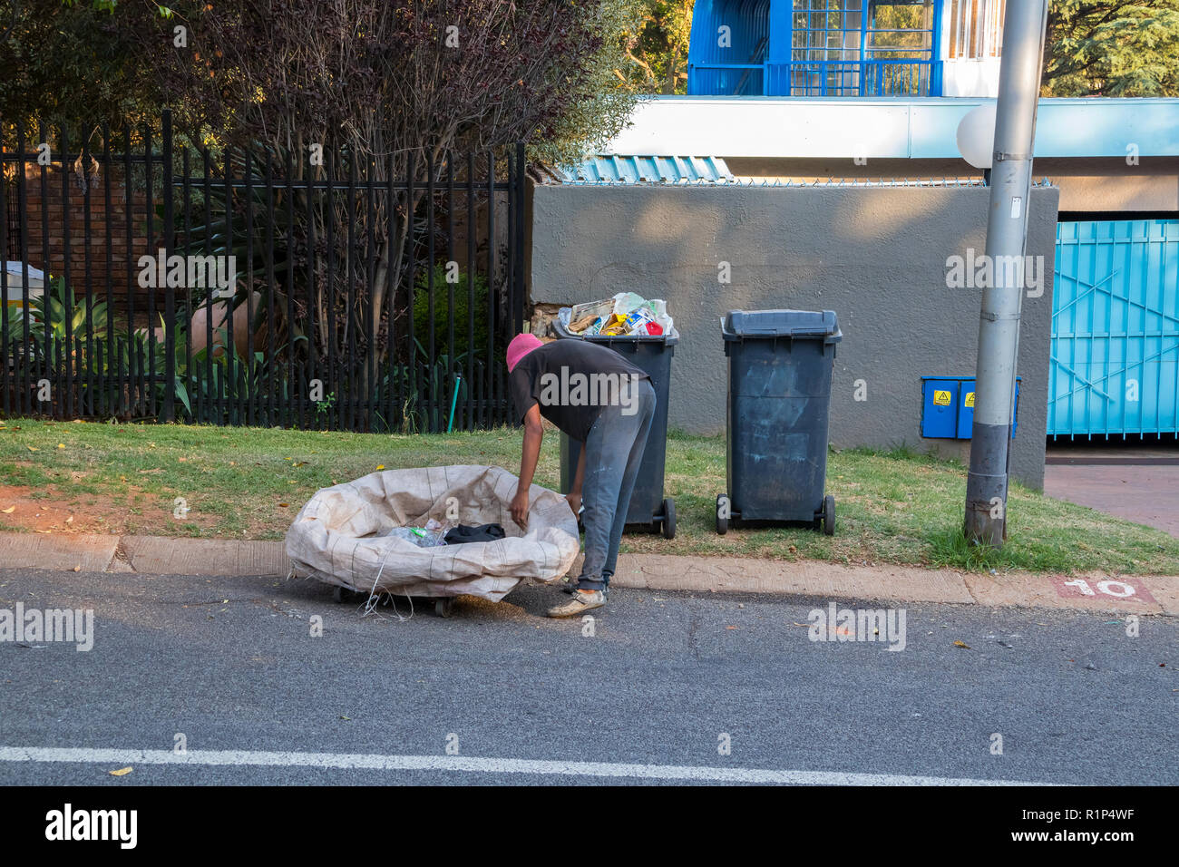Poor and desperate jobless and homeless people raid waste bins in