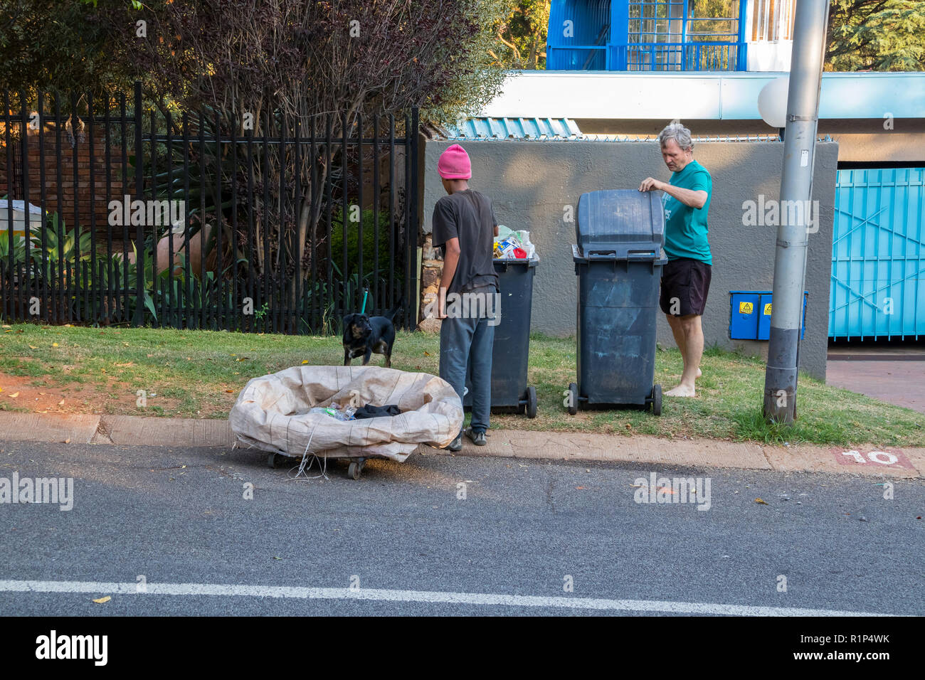 Poor and desperate jobless and homeless people raid waste bins in