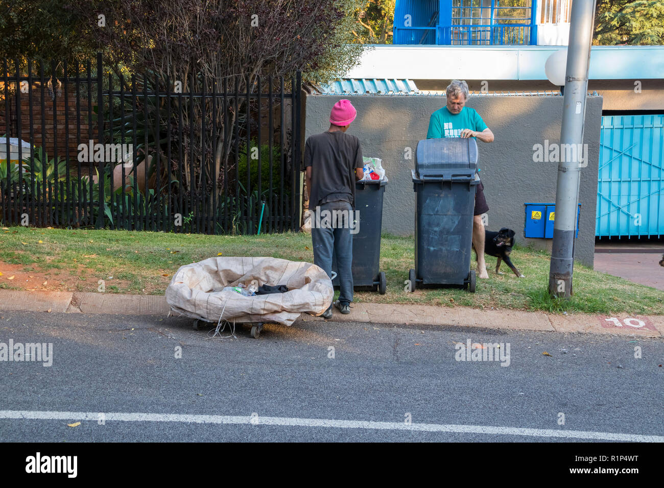 Poor and desperate jobless and homeless people raid waste bins in
