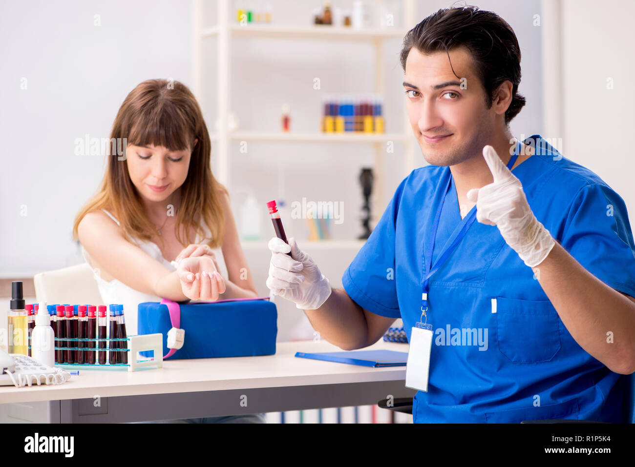 Young patient during blood test sampling procedure Stock Photo - Alamy
