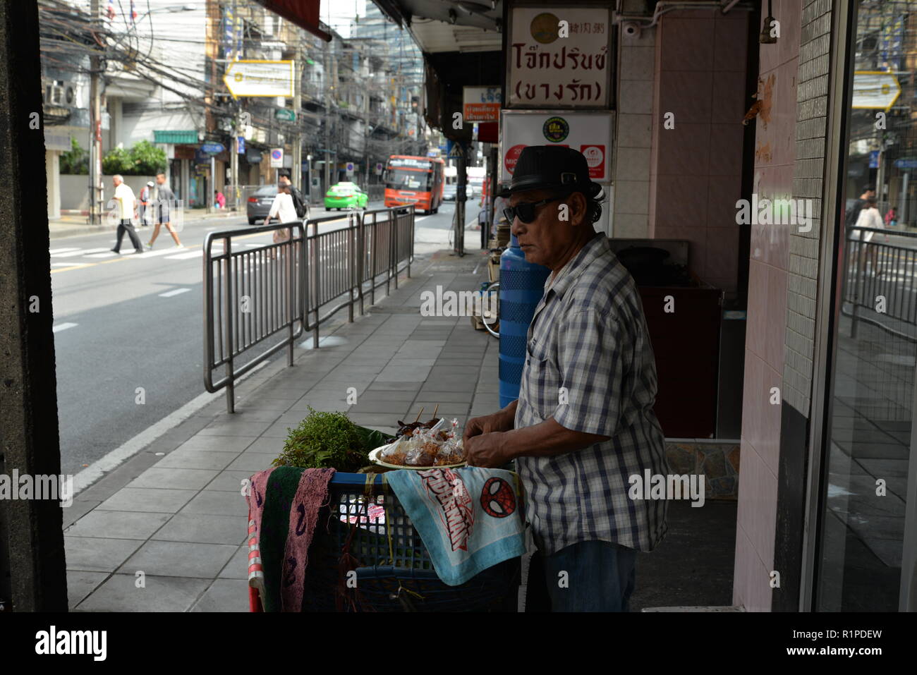 Spiderman, street shot, vendor, south-east Asia Stock Photo
