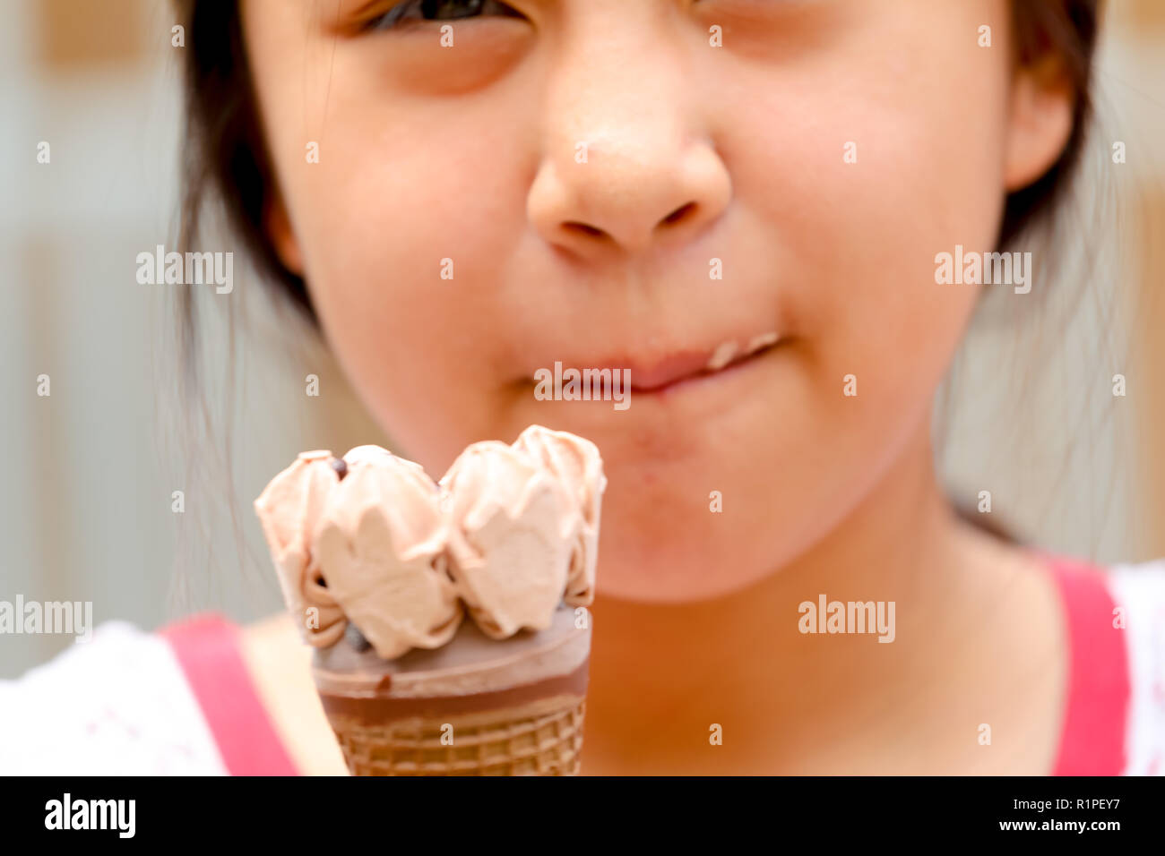 young girl eating ice cream Stock Photo