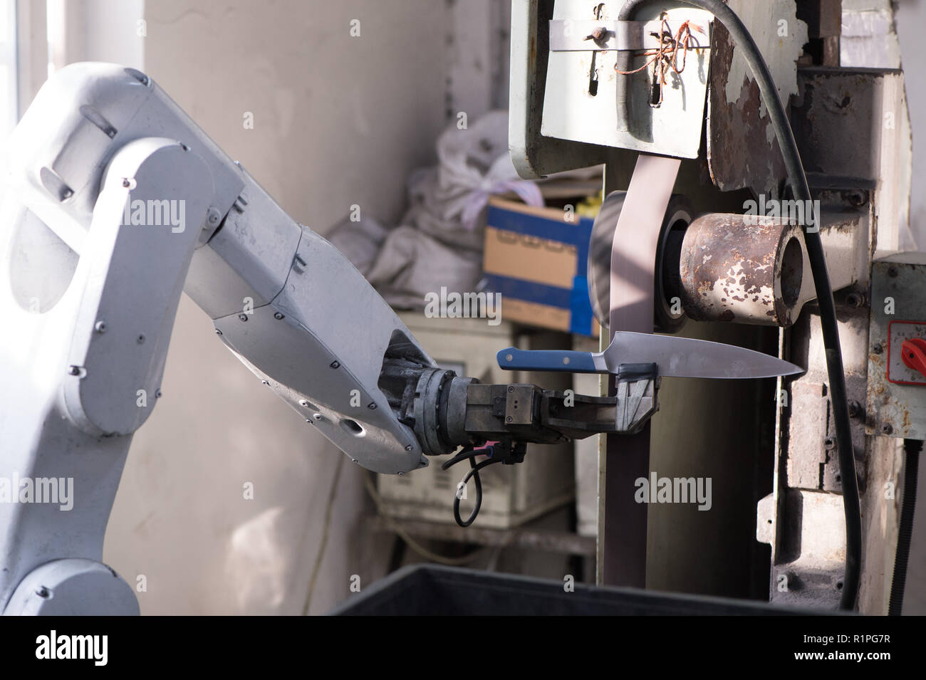Robot arm manufacturing sanding knife blade Stock Photo Alamy