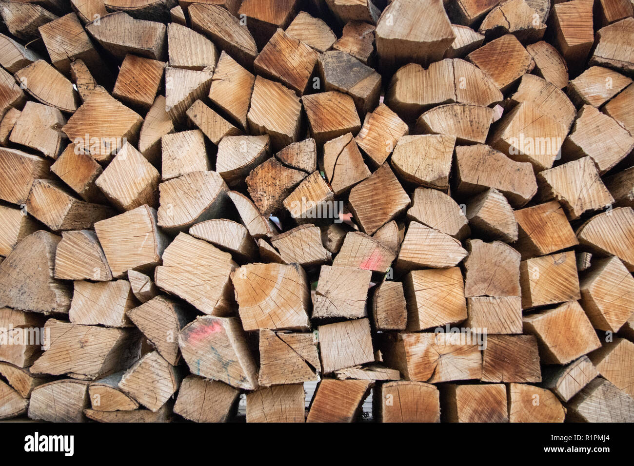 Piles of chopped fire wood side/end view Stock Photo