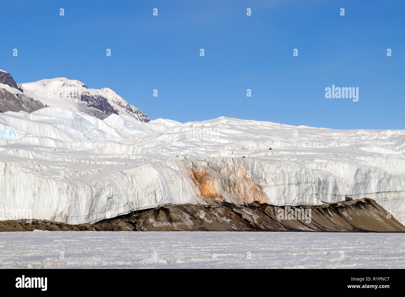 Blood Falls is a reddish colored salty iron rich discharge that emerges from the Taylor Glacier,Taylor Valley, McMurdo Dry Valleys, Antarctica Stock Photo