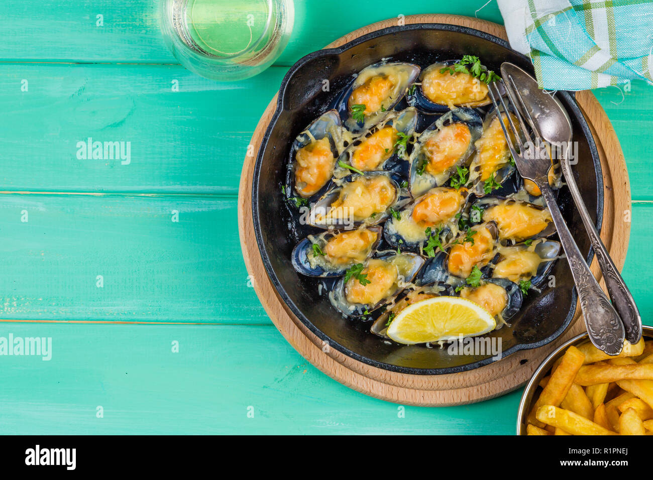 Mussels served with french fries and wine, copy space Stock Photo Alamy