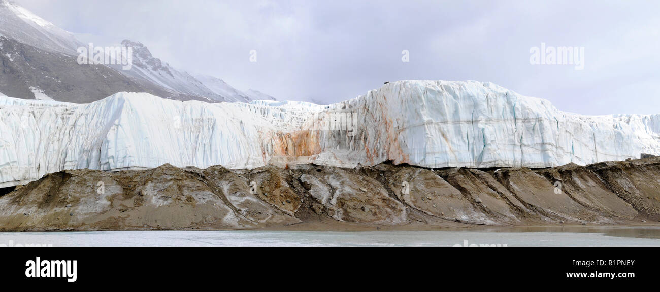 Panorama of Blood Falls, a reddish colored salty iron rich discharge that emerges from Taylor Glacier,Taylor Valley, McMurdo Dry Valleys, Antarctica Stock Photo