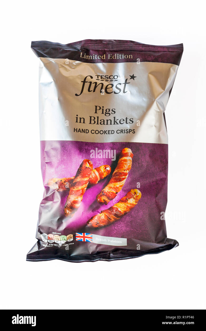 packet of Limited edition Tesco finest Pigs in Blankets hand cooked crisps set on white background made with British potatoes - ready for Christmas Stock Photo
