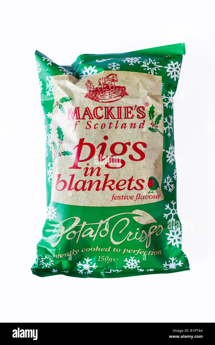 packet of Mackie's of Scotland Pigs in Blankets festive flavour Potato Crisps gently cooked to perfection on white background - ready for Christmas Stock Photo