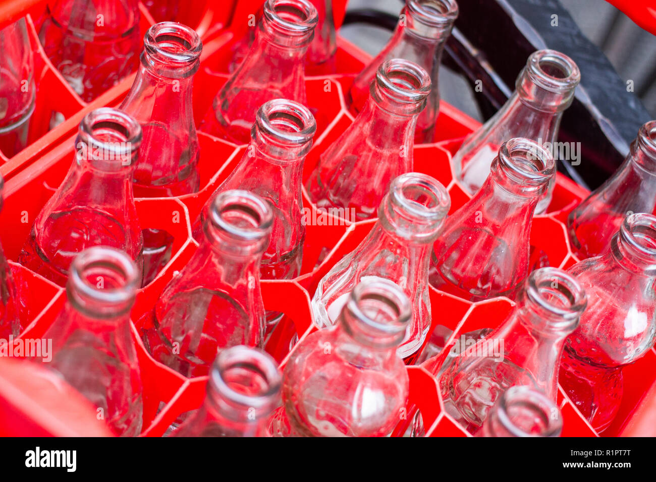 Poland/Krakow - Empy glass bottles, drink, cola in a crate Stock Photo -  Alamy