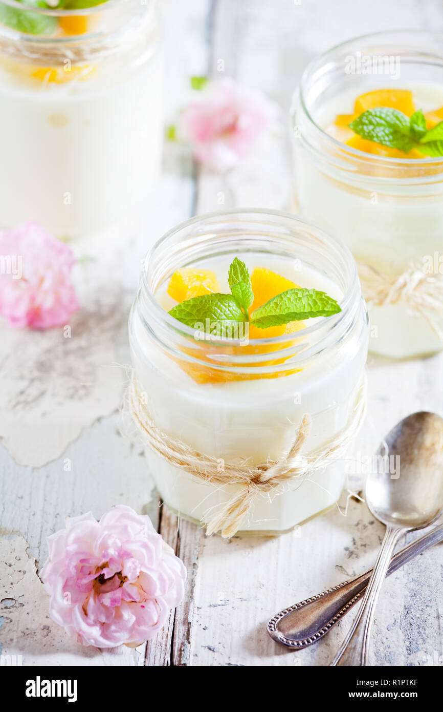 Jars of homemade vanilla pudding with rose extract Stock Photo Alamy