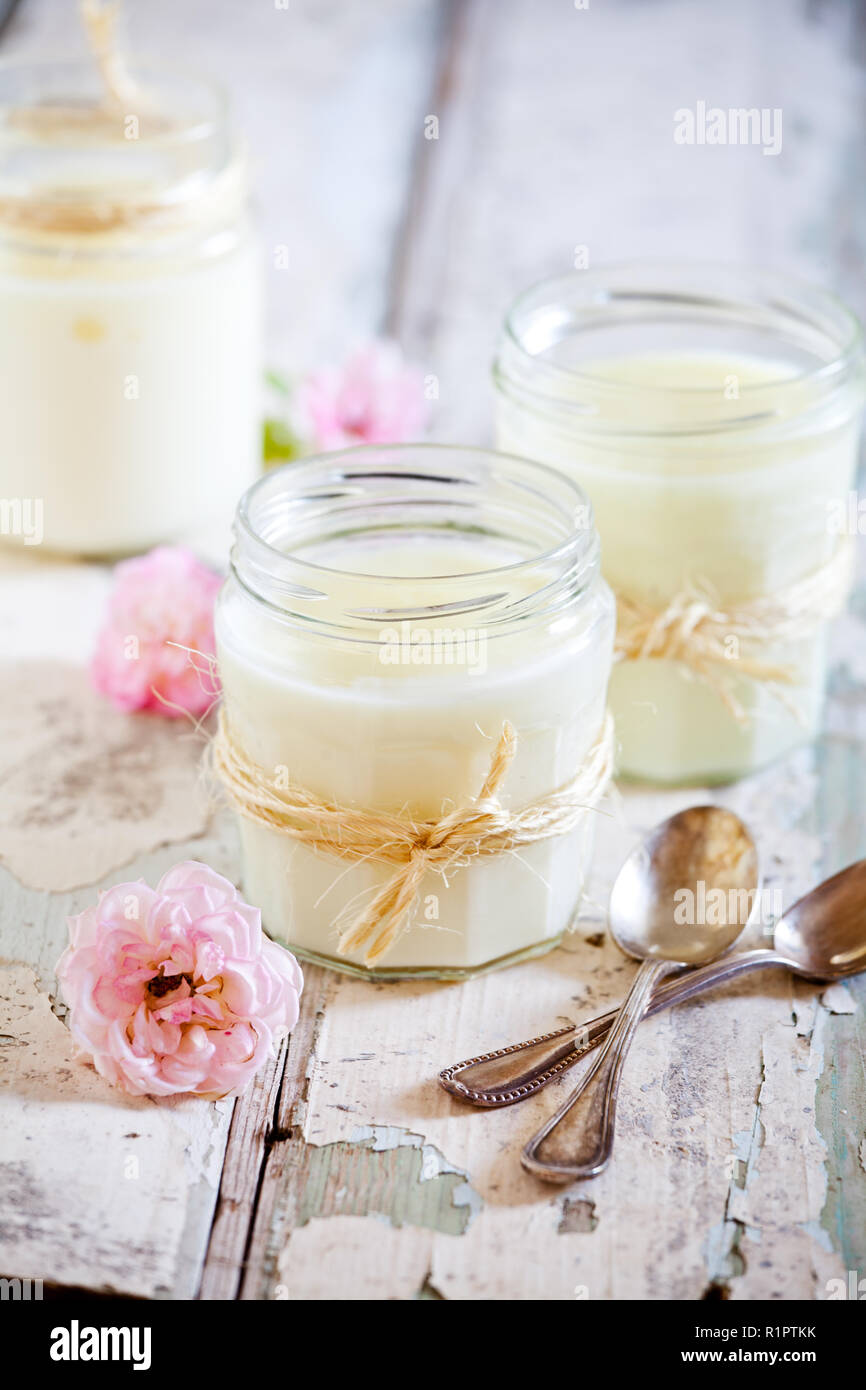 Jars of homemade vanilla pudding with rose extract Stock Photo Alamy