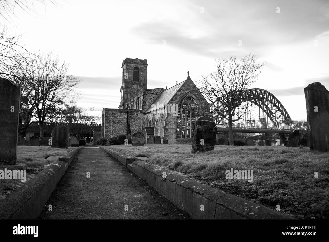 Gateshead/England - February 25th 2012: Gateshead St Mary's Church with Newcastle Tyne Bridge in background Stock Photo