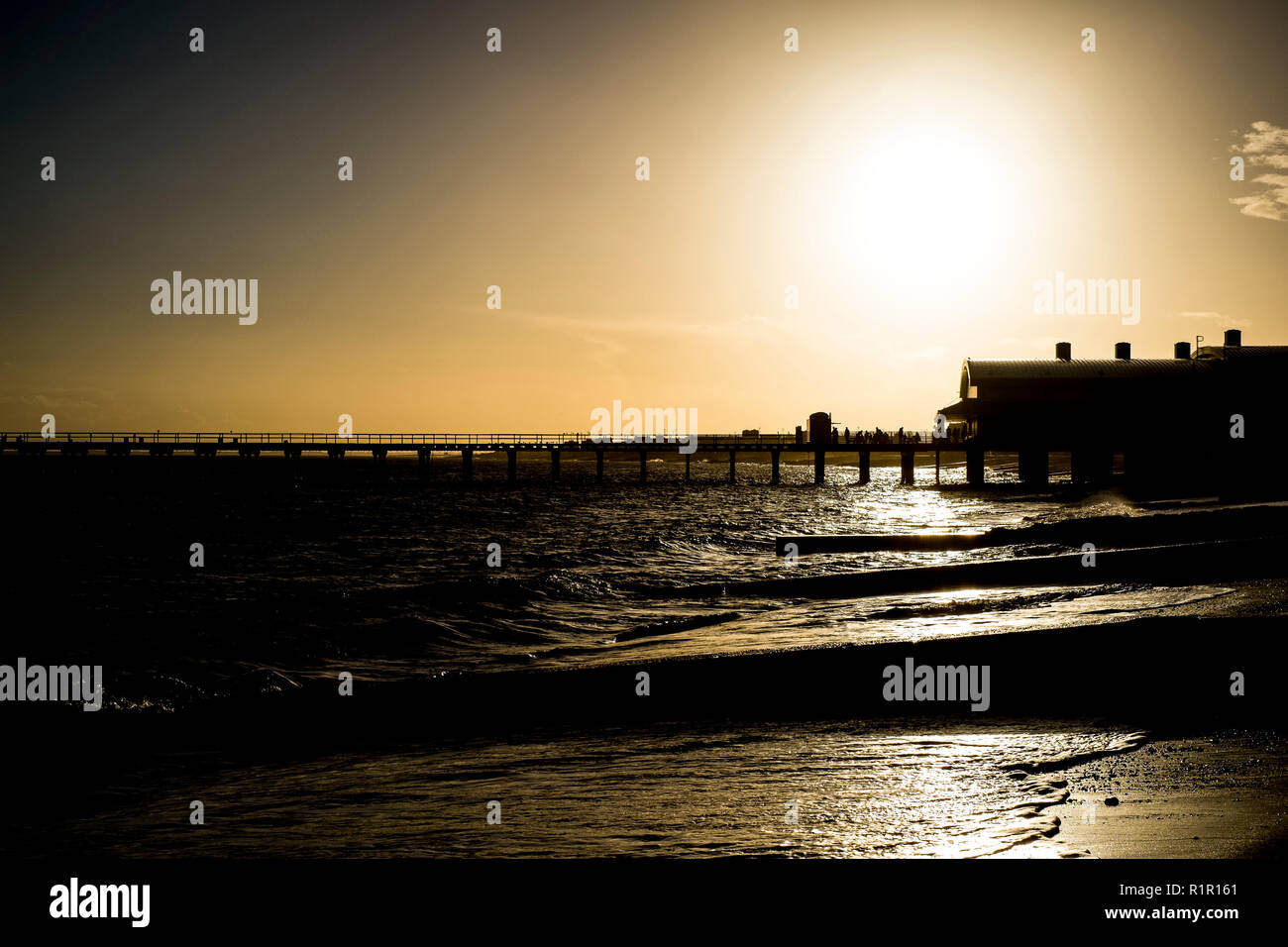 A view of the beach. sea and pier in Felixstowe, Suffolk close to sunset on a winters day Stock Photo