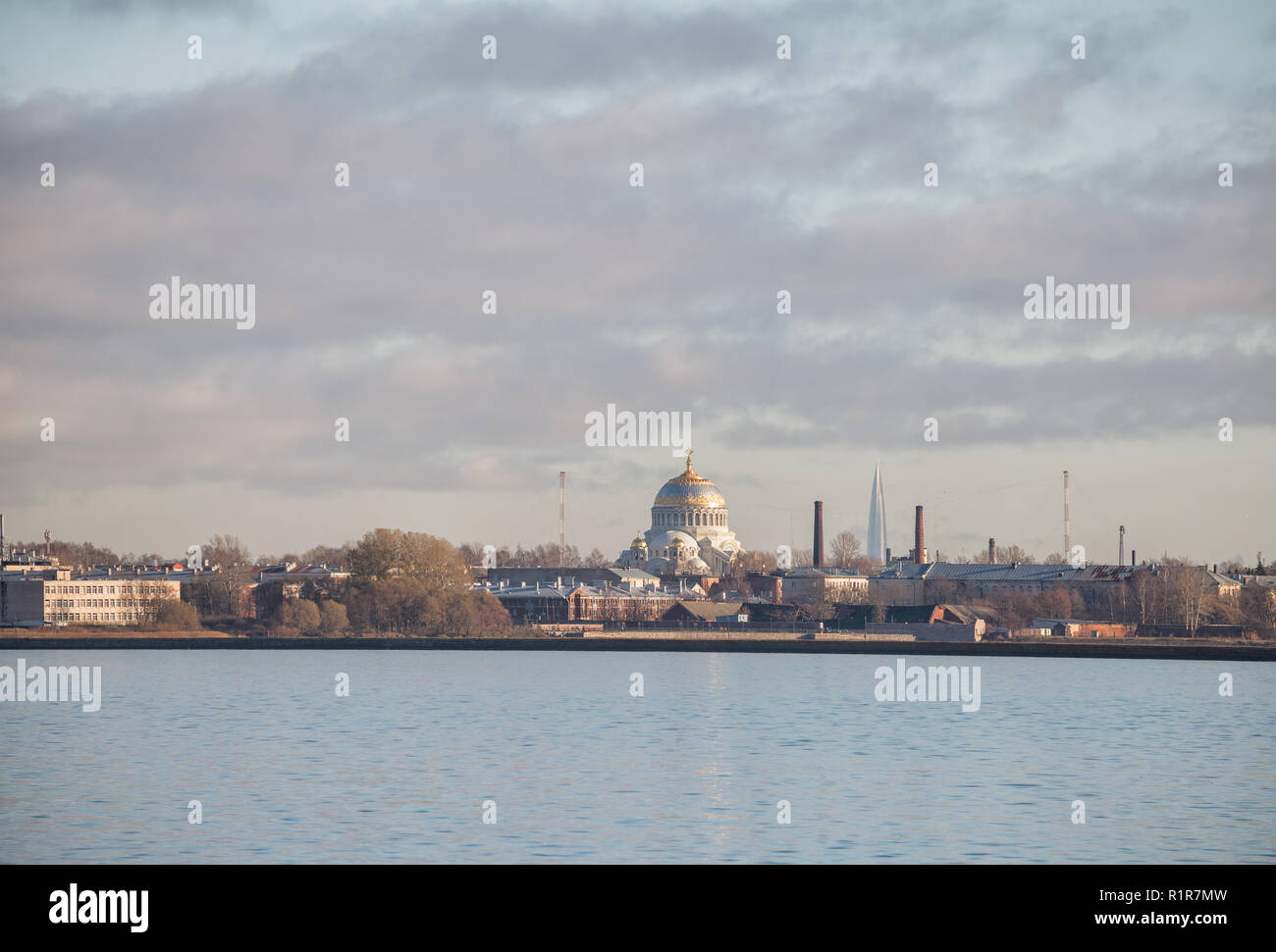 View of Kronstadt from Gulf of Finland. Naval Cathedral and Lakhta Center skyscraper Stock Photo