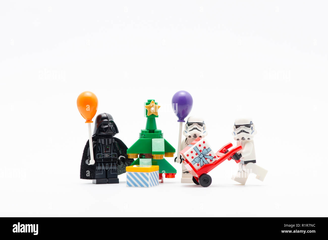 lego darth vader and storm troopers celebrating christmas. Lego minifigures are manufactured by The Lego Group. Stock Photo