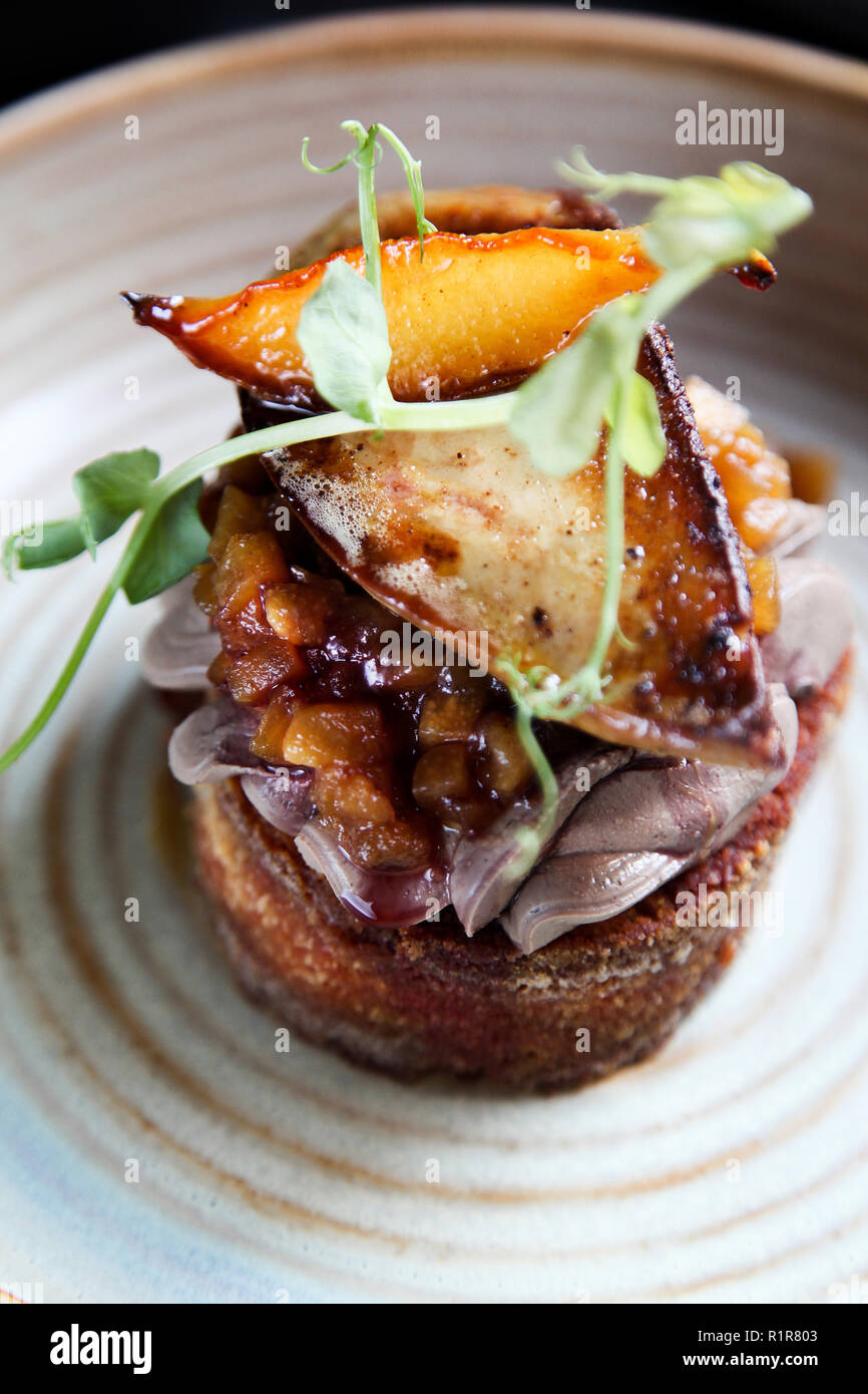 Esthetic French foie gras with apple and pear chutney on the toast in minimalistic style Stock