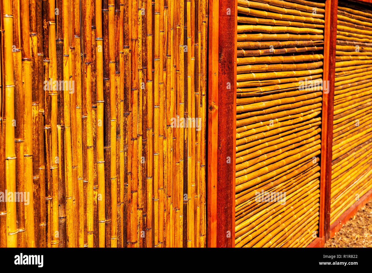 Bamboo fence creates graphic patterns Stock Photo