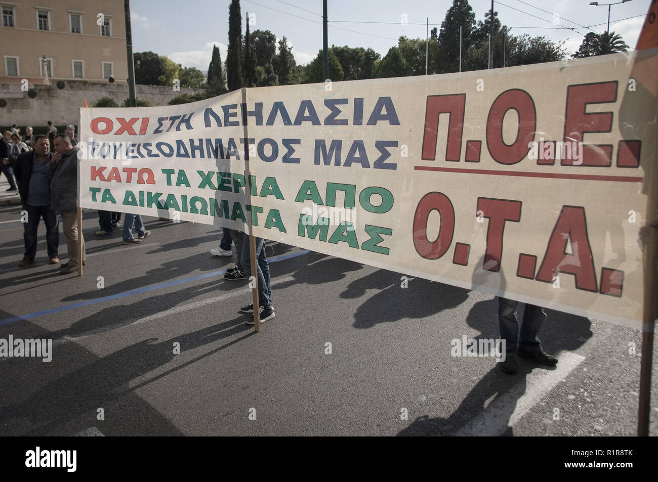 Protesters are seen holding a banner during the strike. The demonstration marks the civil servants 24-hour strike against government's economic policies and high unemployment. Stock Photo